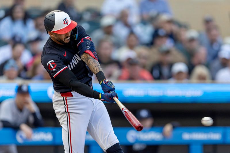 May 14, 2024; Minneapolis, Minnesota, USA; Minnesota Twins shortstop Carlos Correa (4) hits a single against the New York Yankees in the first inning at Target Field. Mandatory Credit: Jesse Johnson-USA TODAY Sports