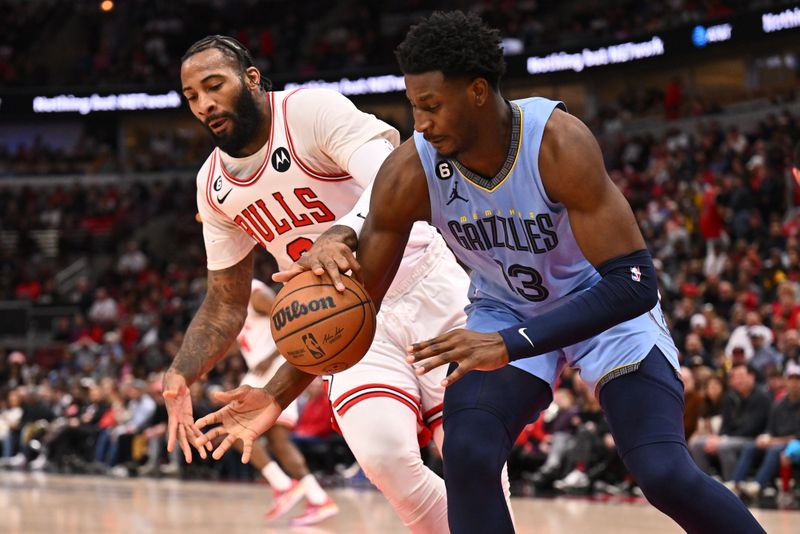 CHICAGO, ILLINOIS - APRIL 02:  Andre Drummond #3 of the Chicago Bulls and Jaren Jackson Jr. #13 of the Memphis Grizzlies battle for control of a loose ball in the first half on April 02, 2023 at United Center in Chicago, Illinois.   NOTE TO USER: User expressly acknowledges and agrees that, by downloading and or using this photograph, User is consenting to the terms and conditions of the Getty Images License Agreement.  (Photo by Jamie Sabau/Getty Images)