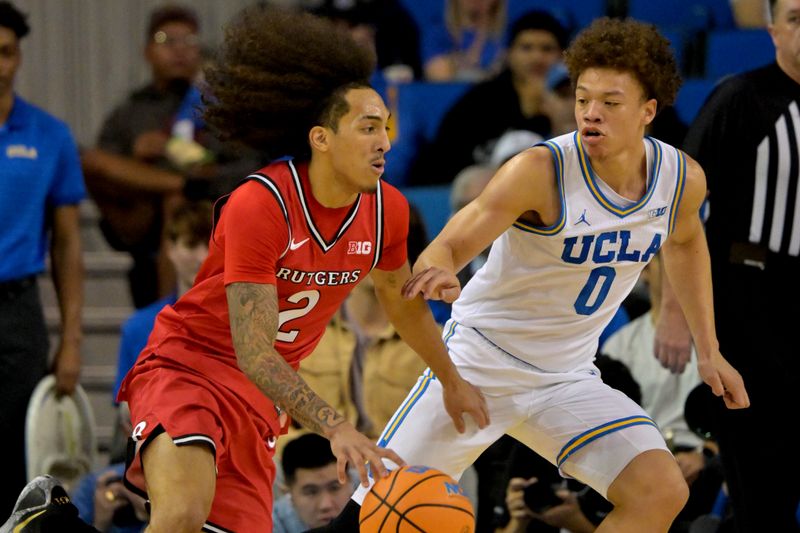 Feb 3, 2026; Los Angeles, California, USA; Rutgers Scarlet Knights guard Lino Mark (2) is defended by UCLA Bruins guard Trent Perry (0) in the first half at Pauley Pavilion presented by Wescom Financial. Mandatory Credit: Jayne Kamin-Oncea-Imagn Images