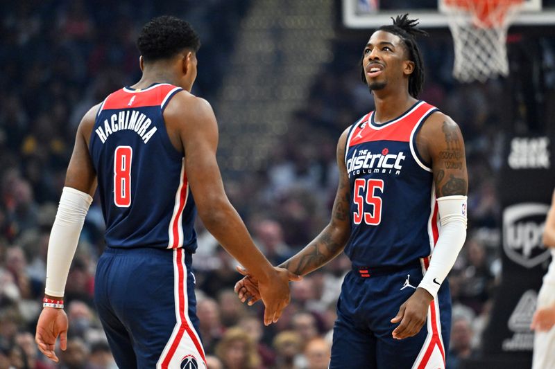 CLEVELAND, OHIO - OCTOBER 23: Rui Hachimura #8 and Delon Wright #55 of the Washington Wizards celebrate during the first quarter against the Cleveland Cavaliers at Rocket Mortgage Fieldhouse on October 23, 2022 in Cleveland, Ohio. NOTE TO USER: User expressly acknowledges and agrees that, by downloading and or using this photograph, User is consenting to the terms and conditions of the Getty Images License Agreement. (Photo by Jason Miller/Getty Images)