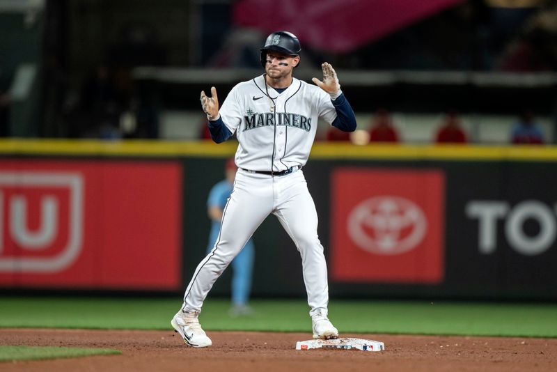 Apr 22, 2023; Seattle, Washington, USA; Seattle Mariners left fielder Jarred Kelenic (10) celebrates after hitting a triple during the fifth inning against the St. Louis Cardinals at T-Mobile Park. Mandatory Credit: Stephen Brashear-USA TODAY Sports