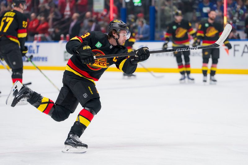 Feb 15, 2024; Vancouver, British Columbia, CAN; Vancouver Canucks defenseman Quinn Hughes (43) shoots during warm up prior to a game against the Detroit Red Wings at Rogers Arena.  Mandatory Credit: Bob Frid-USA TODAY Sports