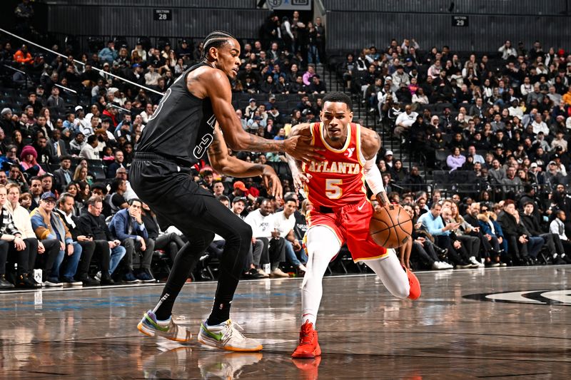 BROOKLYN, NY - FEBRUARY 29: Dejounte Murray #5 of the Atlanta Hawks dribbles the ball during the game against the Brooklyn Nets on February 29, 2024 at Barclays Center in Brooklyn, New York. NOTE TO USER: User expressly acknowledges and agrees that, by downloading and or using this Photograph, user is consenting to the terms and conditions of the Getty Images License Agreement. Mandatory Copyright Notice: Copyright 2024 NBAE (Photo by David Dow/NBAE via Getty Images)