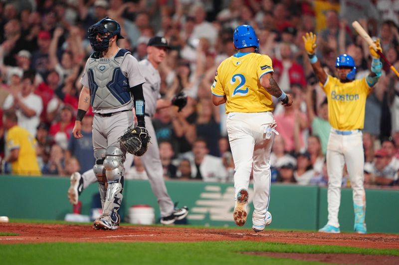 Jul 27, 2024; Boston, Massachusetts, USA; Boston Red Sox first baseman Dominic Smith (2) scores a run on Boston Red Sox second baseman David Hamilton (not pictured) RBI double against the New York Yankees during the seventh inning at Fenway Park. Mandatory Credit: Gregory Fisher-USA TODAY Sports