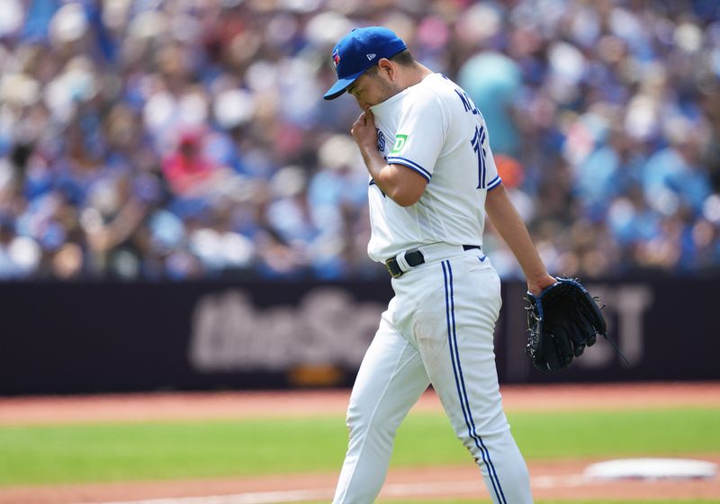 Jul 16, 2023; Toronto, Ontario, CAN; Toronto Blue Jays starting pitcher Yusei Kikuchi (16) walks towards the dugout after being relieved against the Arizona Diamondbacks during the fifth inning at Rogers Centre. Mandatory Credit: Nick Turchiaro-USA TODAY Sports