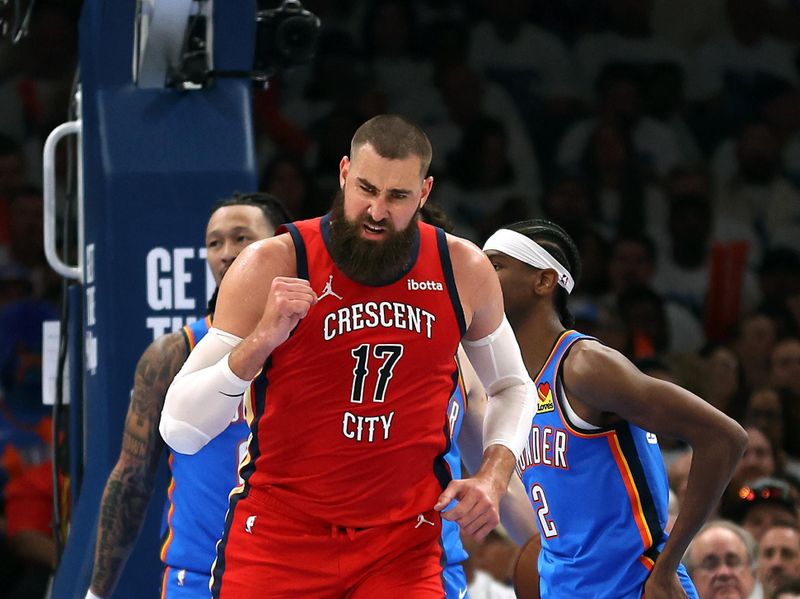 OKLAHOMA CITY, OKLAHOMA - APRIL 24:  Jonas Valanciunas #17 of the New Orleans Pelicans reacts after scoring during game two of the first round of the NBA playoffs against the Oklahoma City Thunder at Paycom Center on April 24, 2024 in Oklahoma City, Oklahoma. (Photo by Jamie Squire/Getty Images)