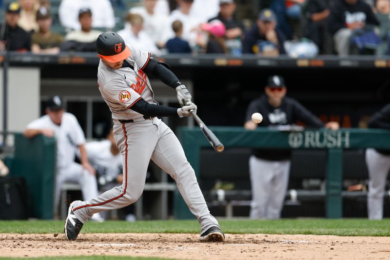 May 26, 2024; Chicago, Illinois, USA; Baltimore Orioles third baseman Jordan Westburg (11) singles against the Chicago White Sox during the sixth inning at Guaranteed Rate Field. Mandatory Credit: Kamil Krzaczynski-USA TODAY Sports