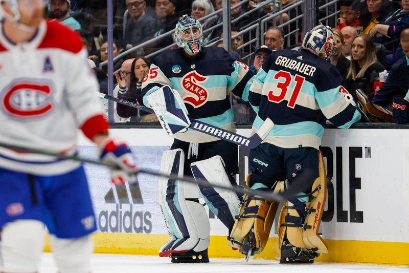 Mar 24, 2024; Seattle, Washington, USA; Seattle Kraken goaltender Joey Daccord (35) replaces goaltender Philipp Grubauer (31) following the fourth goal by the Montreal Canadiens during the first period at Climate Pledge Arena. Mandatory Credit: Joe Nicholson-USA TODAY Sports