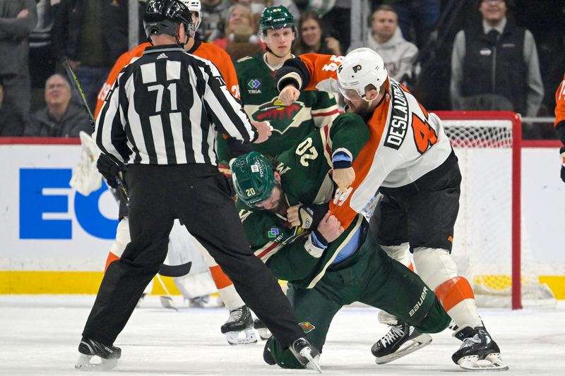 Jan 12, 2024; Saint Paul, Minnesota, USA; Philadelphia Flyers forward Nicolas Deslauriers (44) and Minnesota Wild forward Pat Maroon (20) fight during the first period at Xcel Energy Center. Mandatory Credit: Nick Wosika-USA TODAY Sports