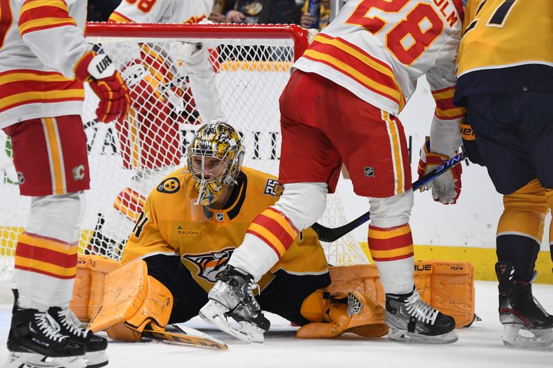 Jan 4, 2024; Nashville, Tennessee, USA; Nashville Predators goaltender Juuse Saros (74) reacts after allowing a goal to Calgary Flames defenseman Noah Hanifin (not pictured) in the closing seconds of the second period at Bridgestone Arena. Mandatory Credit: Christopher Hanewinckel-USA TODAY Sports