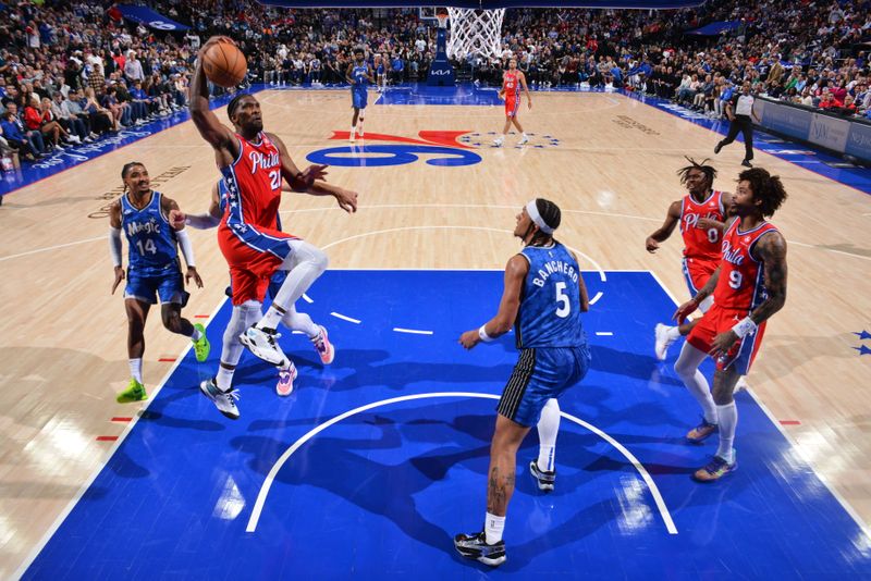 PHILADELPHIA, PA - APRIL 12: Joel Embiid #21 of the Philadelphia 76ers drives to the basket during the game against the Orlando Magic on April 12, 2024 at the Wells Fargo Center in Philadelphia, Pennsylvania NOTE TO USER: User expressly acknowledges and agrees that, by downloading and/or using this Photograph, user is consenting to the terms and conditions of the Getty Images License Agreement. Mandatory Copyright Notice: Copyright 2024 NBAE (Photo by Jesse D. Garrabrant/NBAE via Getty Images)