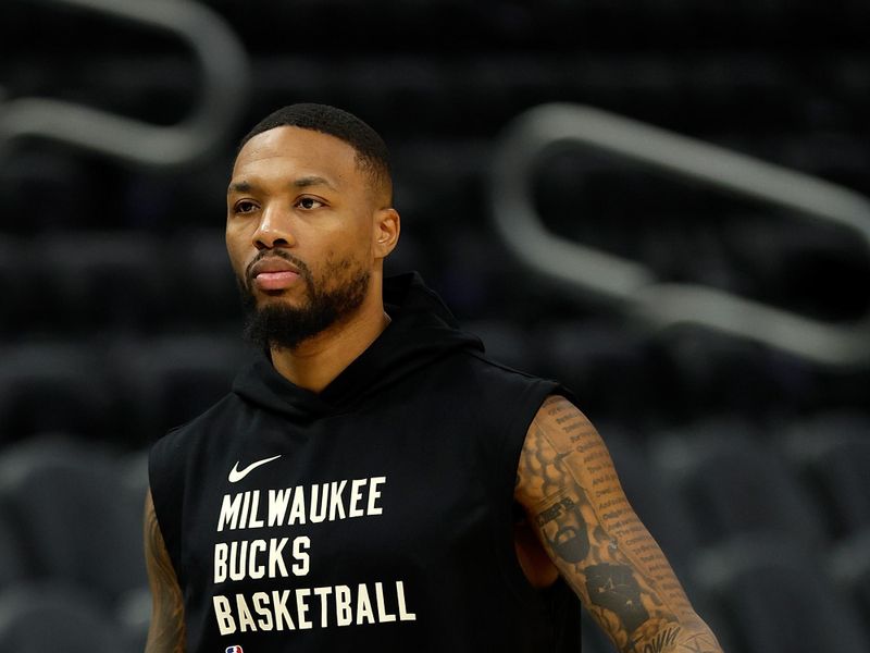 MILWAUKEE, WISCONSIN - OCTOBER 20: Damian Lillard #0 of the Milwaukee Bucks warms up before the preseason game against the Memphis Grizzlies at Fiserv Forum on October 20, 2023 in Milwaukee, Wisconsin. NOTE TO USER: User expressly acknowledges and agrees that, by downloading and or using this photograph, User is consenting to the terms and conditions of the Getty Images License Agreement. (Photo by John Fisher/Getty Images)