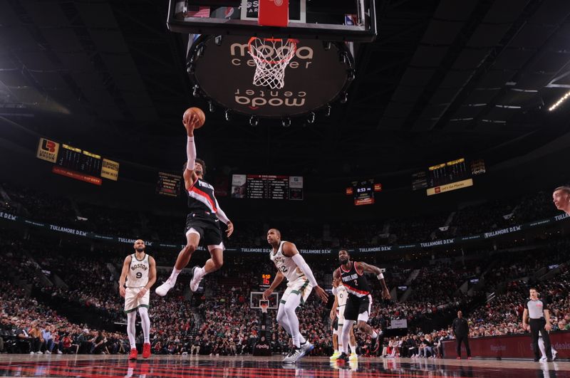 PORTLAND, OR - MARCH 11: Matisse Thybulle #4 of the Portland Trail Blazers drives to the basket during the game against the Boston Celtics on March 11, 2024 at the Moda Center Arena in Portland, Oregon. NOTE TO USER: User expressly acknowledges and agrees that, by downloading and or using this photograph, user is consenting to the terms and conditions of the Getty Images License Agreement. Mandatory Copyright Notice: Copyright 2024 NBAE (Photo by Cameron Browne/NBAE via Getty Images)