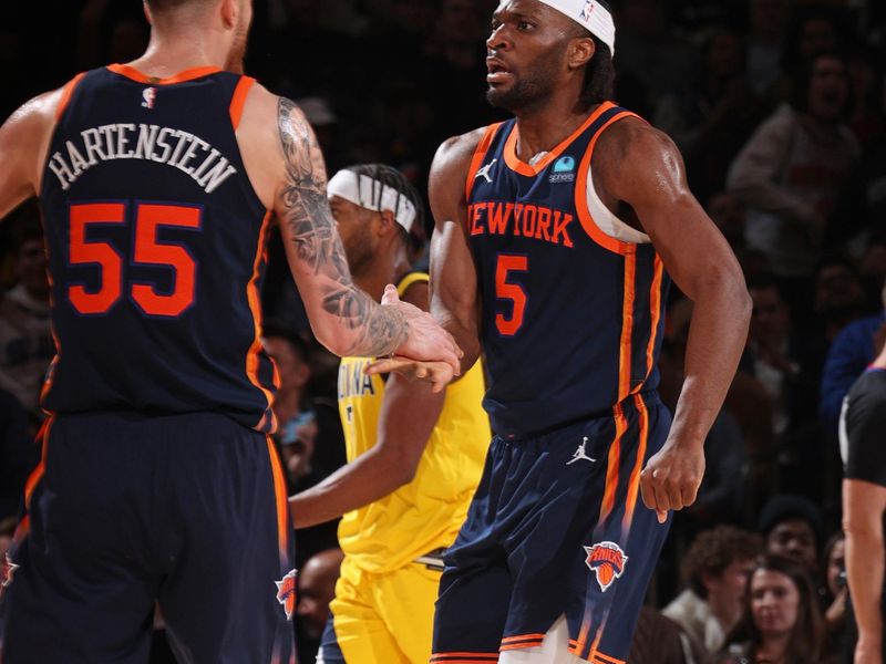 NEW YORK, NY - FEBRUARY 1: Precious Achiuwa #5 high fives Isaiah Hartenstein #55 of the New York Knicks during the game against the Indiana Pacers on February 1, 2024 at Madison Square Garden in New York City, New York.  NOTE TO USER: User expressly acknowledges and agrees that, by downloading and or using this photograph, User is consenting to the terms and conditions of the Getty Images License Agreement. Mandatory Copyright Notice: Copyright 2024 NBAE  (Photo by Nathaniel S. Butler/NBAE via Getty Images)