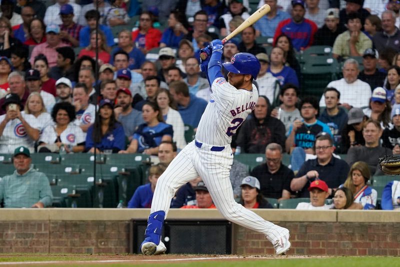 Aug 6, 2024; Chicago, Illinois, USA; Chicago Cubs designated hitter Cody Bellinger (24) hits an infield single against the Minnesota Twins during the first inning at Wrigley Field. Mandatory Credit: David Banks-USA TODAY Sports