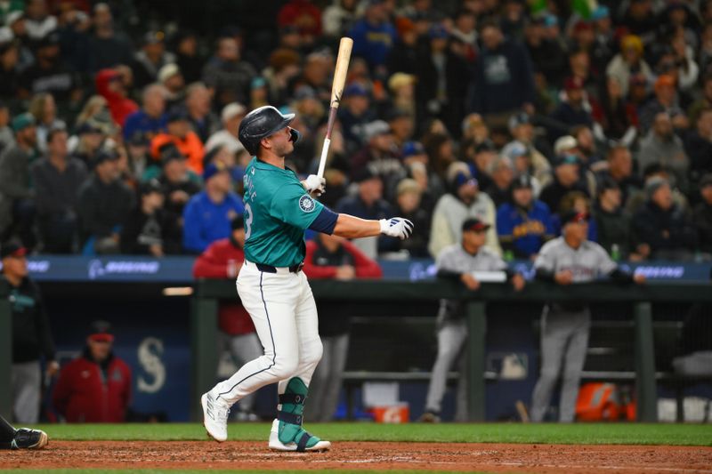 Apr 27, 2024; Seattle, Washington, USA; Seattle Mariners first baseman Ty France (23) hits a 2-run home run against the Arizona Diamondbacks during the seventh inning at T-Mobile Park. Mandatory Credit: Steven Bisig-USA TODAY Sports