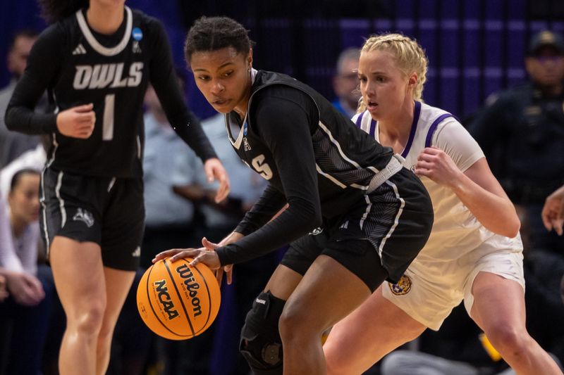 Mar 22, 2024; Baton Rouge, Louisiana, USA; Rice Owls guard Destiny Jackson (5) dribbles against LSU Lady Tigers guard Hailey Van Lith (11) during the second half at Pete Maravich Assembly Center. Mandatory Credit: Stephen Lew-USA TODAY Sports