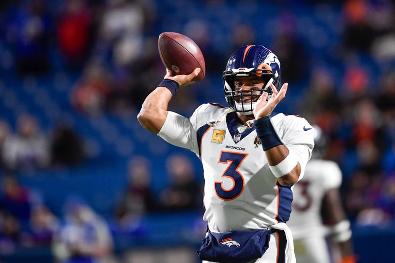 Denver Broncos quarterback Russell Wilson warms up before an NFL football game against the Buffalo Bills, Monday, Nov. 13, 2023, in Orchard Park, N.Y. (AP Photo/Adrian Kraus)