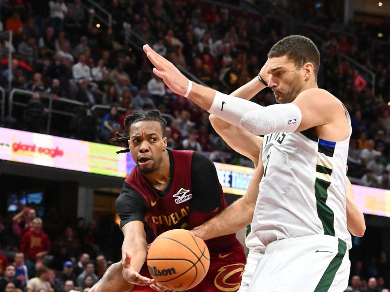 CLEVELAND, OHIO - NOVEMBER 04: Darius Garland #10 of the Cleveland Cavaliers passes around Brook Lopez #11 of the Milwaukee Bucks during the fourth quarter at Rocket Mortgage Fieldhouse on November 04, 2024 in Cleveland, Ohio. The Cavaliers defeated the Bucks 116-114. NOTE TO USER: User expressly acknowledges and agrees that, by downloading and or using this photograph, User is consenting to the terms and conditions of the Getty Images License Agreement. (Photo by Jason Miller/Getty Images)