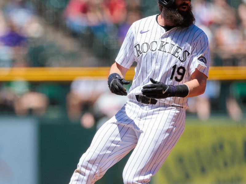 Jun 5, 2024; Denver, Colorado, USA; Colorado Rockies outfielder Charlie Blackmon (19) runs to third base during the first inning against the Cincinnati Reds at Coors Field. Mandatory Credit: Andrew Wevers-USA TODAY Sports