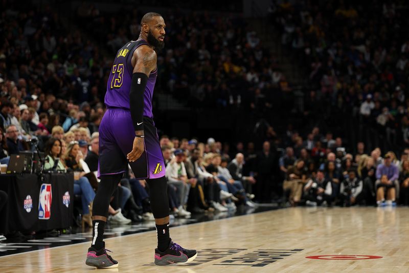 MINNEAPOLIS, MINNESOTA - DECEMBER 02: LeBron James #23 of the Los Angeles Lakers looks on against the Minnesota Timberwolves in the third quarter at Target Center on December 02, 2024 in Minneapolis, Minnesota. The Timberwolves defeated the Lakers 109-80. NOTE TO USER: User expressly acknowledges and agrees that, by downloading and or using this photograph, User is consenting to the terms and conditions of the Getty Images License Agreement. (Photo by David Berding/Getty Images)