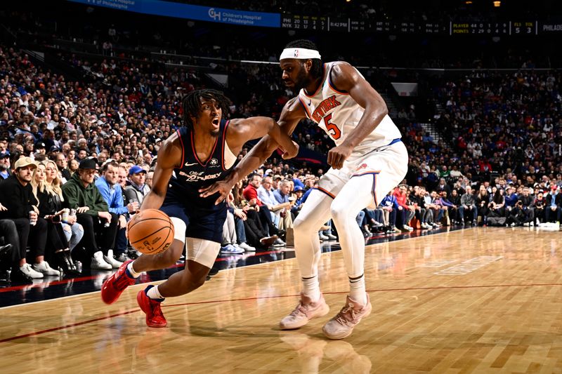 PHILADELPHIA, PA - FEBRUARY 22: Tyrese Maxey #0 of the Philadelphia 76ers drives to the basket during the game against the New York Knicks on February 22, 2024 at the Wells Fargo Center in Philadelphia, Pennsylvania NOTE TO USER: User expressly acknowledges and agrees that, by downloading and/or using this Photograph, user is consenting to the terms and conditions of the Getty Images License Agreement. Mandatory Copyright Notice: Copyright 2024 NBAE (Photo by David Dow/NBAE via Getty Images)