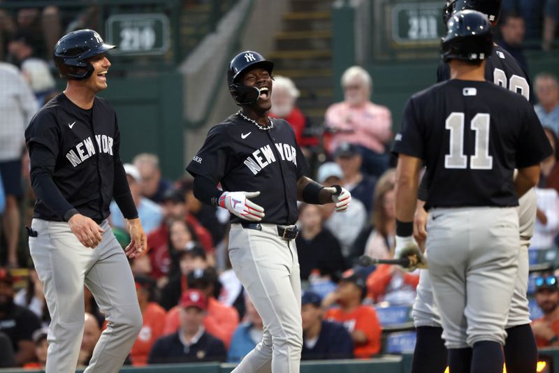 Mar 20, 2025; Sarasota, Florida, USA;  New York Yankees third base Jazz Chisholm Jr. (13) is congratulated by outfielder Cody Bellinger (35), outfielder Aaron Judge (99) and shortstop Anthony Volpe (11) after hitting a three-run home run during the third inning against the Baltimore Orioles at Ed Smith Stadium. Mandatory Credit: Kim Klement Neitzel-Imagn Images
