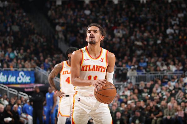 MILWAUKEE, WI - DECEMBER 2: Trae Young #11 of the Atlanta Hawks shoots a free throw during the game against the Milwaukee Bucks on December 2, 2023 at the Fiserv Forum Center in Milwaukee, Wisconsin. NOTE TO USER: User expressly acknowledges and agrees that, by downloading and or using this Photograph, user is consenting to the terms and conditions of the Getty Images License Agreement. Mandatory Copyright Notice: Copyright 2023 NBAE (Photo by Gary Dineen/NBAE via Getty Images).