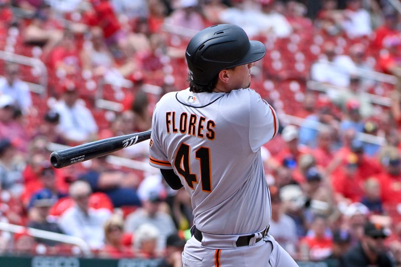 Jun 14, 2023; St. Louis, Missouri, USA;  San Francisco Giants designated hitter Wilmer Flores (41) hits a one run single against the St. Louis Cardinals during the tenth inning at Busch Stadium. Mandatory Credit: Jeff Curry-USA TODAY Sports