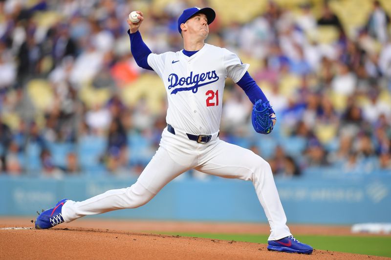 May 31, 2024; Los Angeles, California, USA; Los Angeles Dodgers pitcher Walker Buehler (21) throws against the Colorado Rockies during the first inning at Dodger Stadium. Mandatory Credit: Gary A. Vasquez-USA TODAY Sports