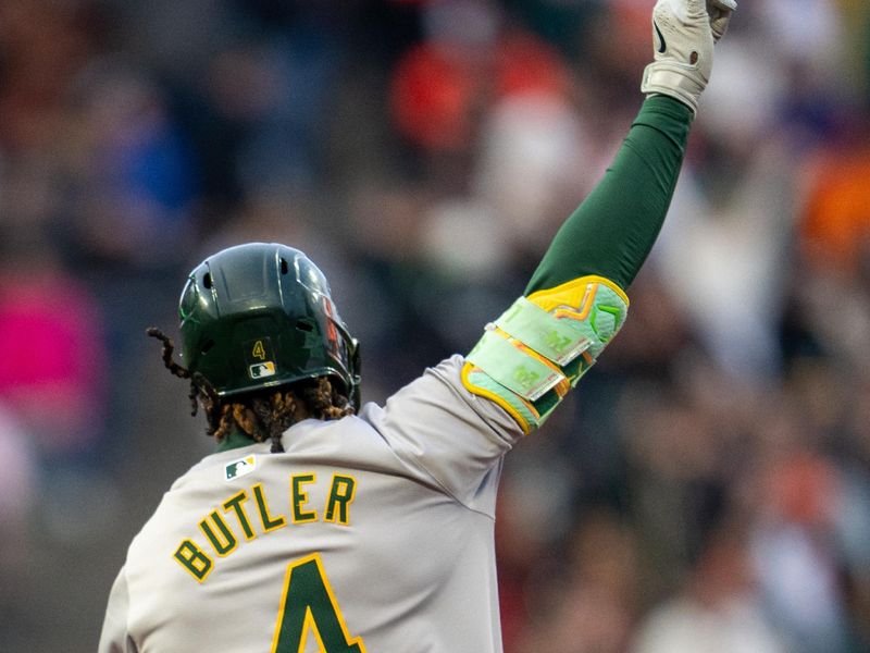 Jul 30, 2024; San Francisco, California, USA;  Oakland Athletics right fielder Lawrence Butler (4) celebrates as he circles the bases after hitting a solo home run during the third inning against the San Francisco Giants at Oracle Park. Mandatory Credit: Neville E. Guard-USA TODAY Sports