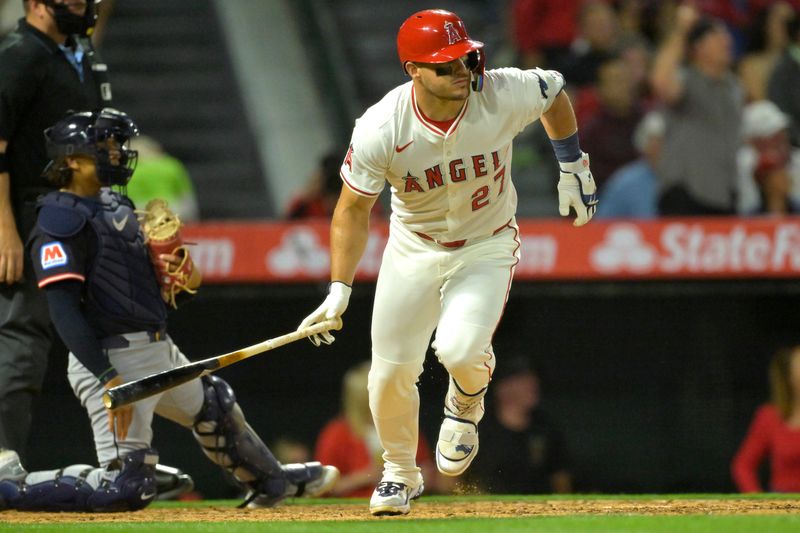 Apr 5, 2025; Anaheim, California, USA;  Los Angeles Angels center fielder Mike Trout (27) hits a two-run home run in the fifth inning against the Cleveland Guardians at Angel Stadium. Mandatory Credit: Jayne Kamin-Oncea-Imagn Images