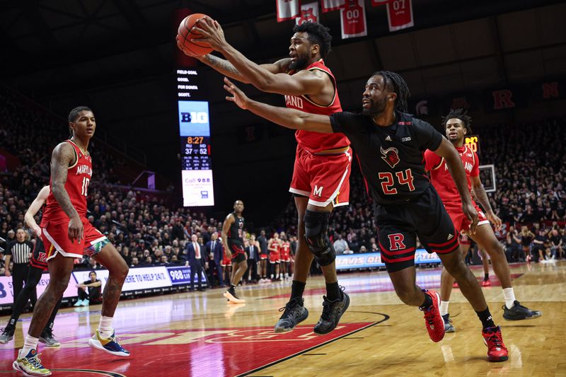 Feb 25, 2024; Piscataway, New Jersey, USA; Maryland Terrapins forward Donta Scott (24) rebounds in front of Rutgers Scarlet Knights guard Austin Williams (24) during the second half at Jersey Mike's Arena. Mandatory Credit: Vincent Carchietta-USA TODAY Sports