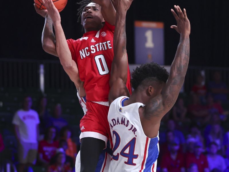 Nov 23, 2022; Paradise Island, BAHAMAS; North Carolina State Wolfpack guard Terquavion Smith (0) shoots over Kansas Jayhawks forward K.J. Adams Jr. (24) during the second half at Imperial Arena. Mandatory Credit: Kevin Jairaj-USA TODAY Sports