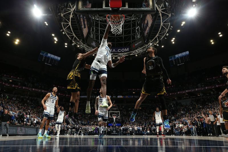 MINNEAPOLIS, MN -  FEBRUARY 1: Naz Reid #11 of the Minnesota Timberwolves drives to the basket during the game against the Golden State Warriors on February 1, 2023 at Target Center in Minneapolis, Minnesota. NOTE TO USER: User expressly acknowledges and agrees that, by downloading and or using this Photograph, user is consenting to the terms and conditions of the Getty Images License Agreement. Mandatory Copyright Notice: Copyright 2023 NBAE (Photo by David Sherman/NBAE via Getty Images)