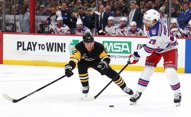 Jan 31, 2026; Pittsburgh, Pennsylvania, USA;  New York Rangers defenseman Matthew Robertson (29) moves the puck against Pittsburgh Penguins right wing Rutger McGroarty (2) during the third period at PPG Paints Arena. Mandatory Credit: Charles LeClaire-Imagn Images