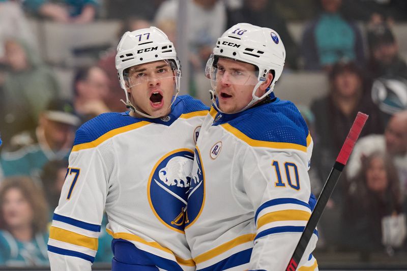 Jan 27, 2024; San Jose, California, USA; Buffalo Sabres right wing JJ Peterka (77) celebrates with defenseman Henri Jokiharju (10) after scoring a goal against the San Jose Sharks during the first period at SAP Center at San Jose. Mandatory Credit: Robert Edwards-USA TODAY Sports