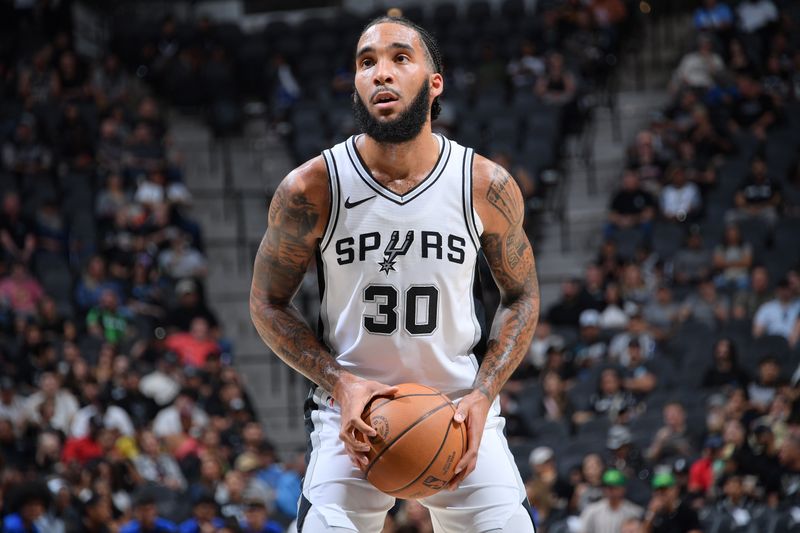 SAN ANTONIO, TX - OCTOBER 9: Julian Champagnie #30 of the San Antonio Spurs handles the ball during the game against the Orlando Magic during a NBA preseason game on October 9, 2024 at the Frost Bank Center in San Antonio, Texas. NOTE TO USER: User expressly acknowledges and agrees that, by downloading and or using this photograph, user is consenting to the terms and conditions of the Getty Images License Agreement. Mandatory Copyright Notice: Copyright 2024 NBAE (Photos by Michael Gonzales/NBAE via Getty Images)