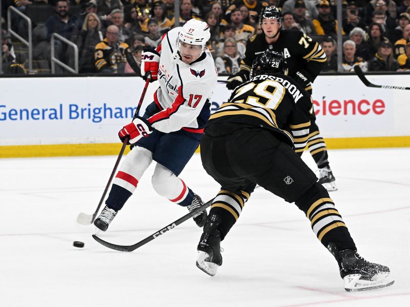 Feb 10, 2024; Boston, Massachusetts, USA; Washington Capitals center Dylan Strome (17) takes a shot in front of Boston Bruins defenseman Parker Wotherspoon (29) during the second period at the TD Garden. Mandatory Credit: Brian Fluharty-USA TODAY Sports