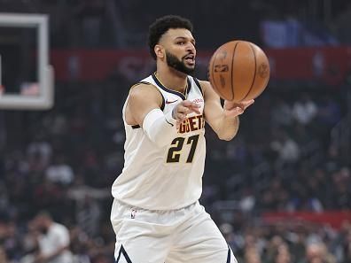 LOS ANGELES, CALIFORNIA - DECEMBER 06: Jamal Murray #27 of the Denver Nuggets passes against the LA Clippers during the first half of a game at Crypto.com Arena on December 06, 2023 in Los Angeles, California. NOTE TO USER: User expressly acknowledges and agrees that, by downloading and or using this photograph, User is consenting to the terms and conditions of the Getty Images License Agreement. (Photo by Michael Owens/Getty Images)