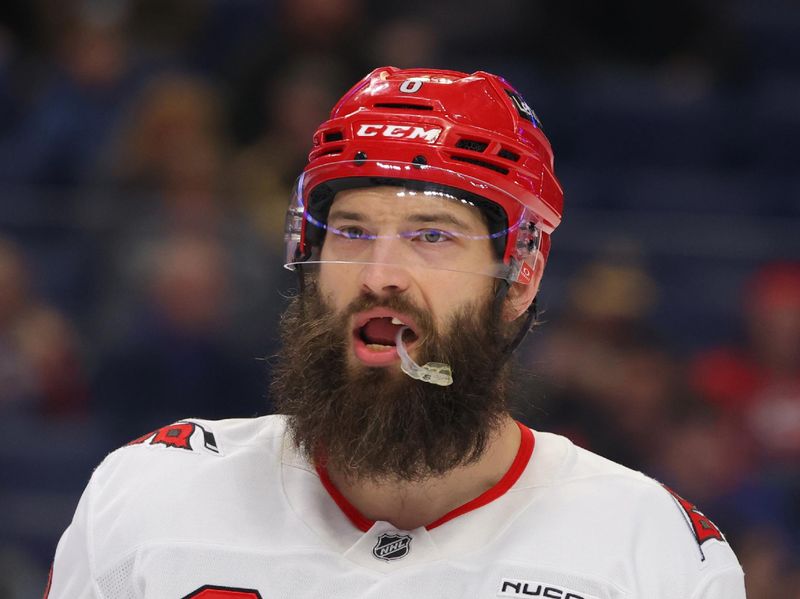 Jan 15, 2025; Buffalo, New York, USA;  Carolina Hurricanes defenseman Brent Burns (8) waits for the face-off during the first period against the Buffalo Sabres at KeyBank Center. Mandatory Credit: Timothy T. Ludwig-Imagn Images