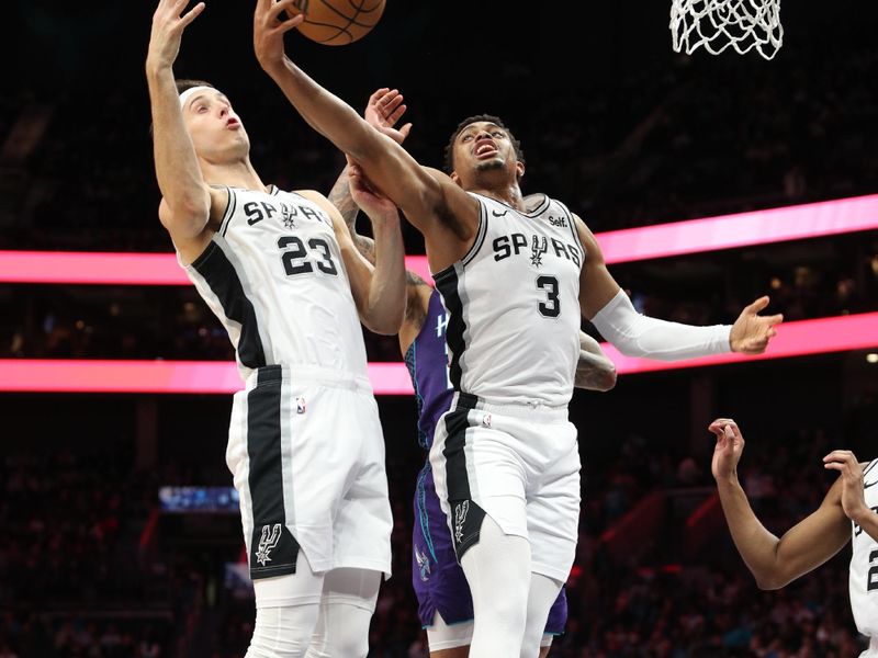 CHARLOTTE, NC - JANUARY 19: Keldon Johnson #3 of the San Antonio Spurs rebounds the ball during the game against the Charlotte Hornets on January 19, 2024 at Spectrum Center in Charlotte, North Carolina. NOTE TO USER: User expressly acknowledges and agrees that, by downloading and or using this photograph, User is consenting to the terms and conditions of the Getty Images License Agreement.  Mandatory Copyright Notice:  Copyright 2024 NBAE (Photo by Brock Williams-Smith/NBAE via Getty Images)