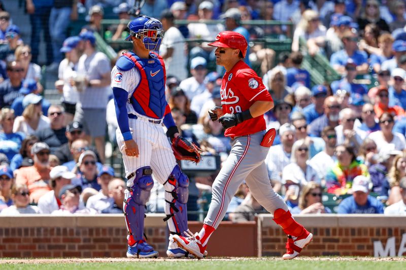 Jun 2, 2024; Chicago, Illinois, USA; 
Cincinnati Reds outfielder TJ Friedl (29) crosses home plate after hitting a three-run home run against the Chicago Cubs during the second inning at Wrigley Field. Mandatory Credit: Kamil Krzaczynski-USA TODAY Sports