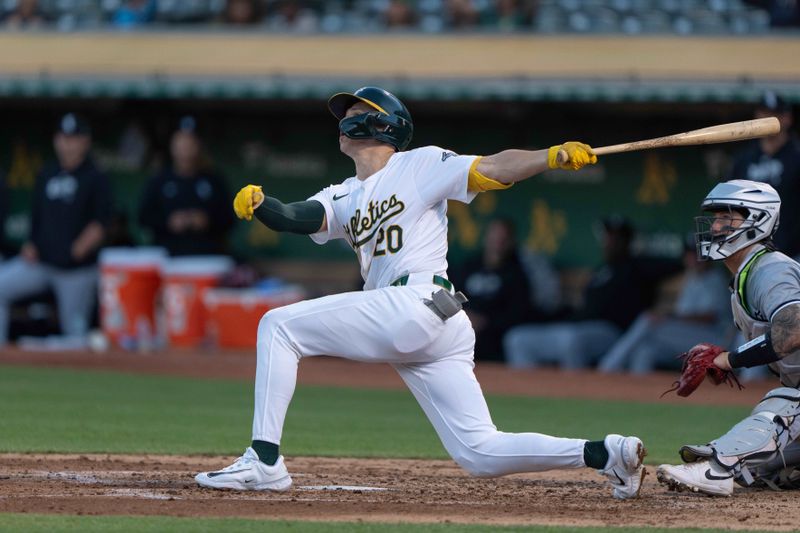 Aug 6, 2024; Oakland, California, USA;  Oakland Athletics second base Zack Gelof (20) hits a solo home run during the fourth inning against the Chicago White Sox at Oakland-Alameda County Coliseum. Mandatory Credit: Stan Szeto-USA TODAY Sports