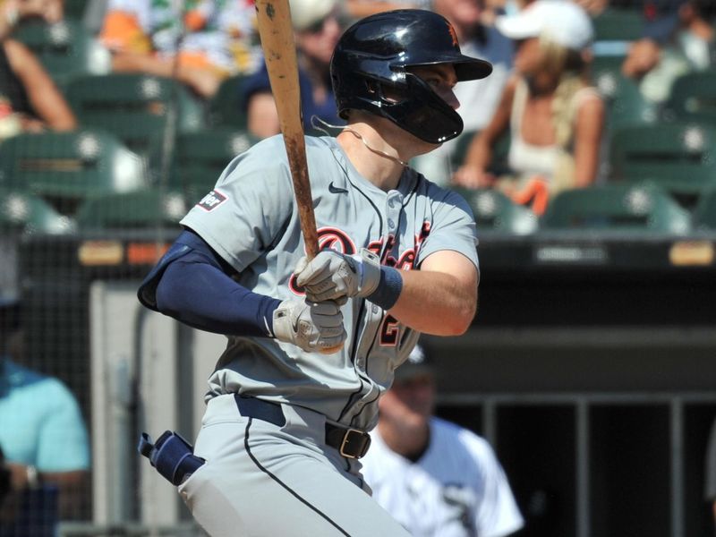 Aug 25, 2024; Chicago, Illinois, USA; Detroit Tigers shortstop Trey Sweeney (27) hits an RBI single during the fifth inning against the Chicago White Sox at Guaranteed Rate Field. Mandatory Credit: Patrick Gorski-USA TODAY Sports
