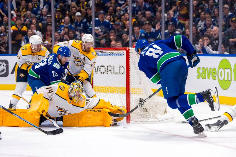 Apr 23, 2024; Vancouver, British Columbia, CAN; Nashville Predators defenseman Roman Josi (59) and defenseman Ryan McDonagh (27) and Vancouver Canucks forward Elias Lindholm (23) all watch as goalie Juuse Saros (74) makes a save on forward Dakota Joshua (81) during the third period in game two of the first round of the 2024 Stanley Cup Playoffs at Rogers Arena. Mandatory Credit: Bob Frid-USA TODAY Sports