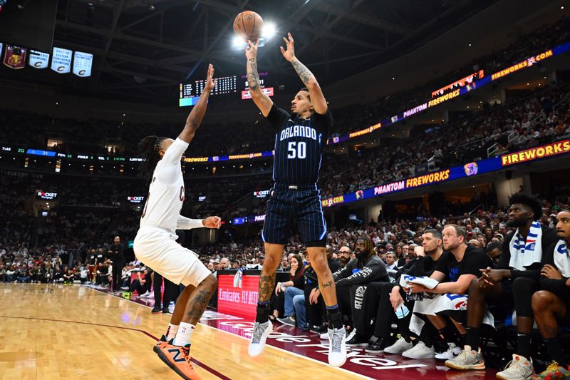 CLEVELAND, OHIO - APRIL 20: Cole Anthony #50 of the Orlando Magic shoots over Darius Garland #10 of the Cleveland Cavaliers during the second quarter of game one of the Eastern Conference First Round Playoffs at Rocket Mortgage Fieldhouse on April 20, 2024 in Cleveland, Ohio. NOTE TO USER: User expressly acknowledges and agrees that, by downloading and or using this photograph, User is consenting to the terms and conditions of the Getty Images License Agreement. (Photo by Jason Miller/Getty Images)