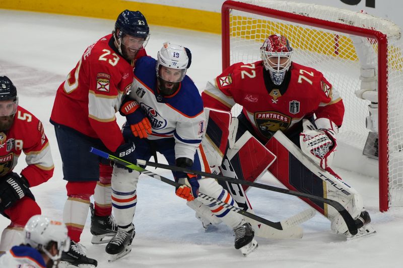 Jun 24, 2024; Sunrise, Florida, USA; Florida Panthers forward Carter Verhaeghe (23) defends against Edmonton Oilers forward Adam Henrique (19) during the first period in game seven of the 2024 Stanley Cup Final at Amerant Bank Arena. Mandatory Credit: Jim Rassol-USA TODAY Sports
