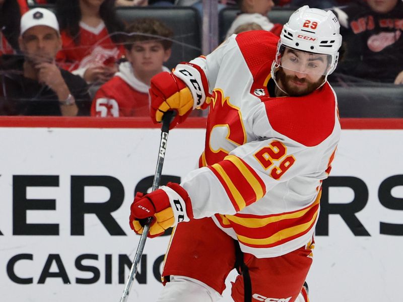 Oct 22, 2023; Detroit, Michigan, USA;  Calgary Flames center Dillon Dube (29) takes a shot in the third period against the Detroit Red Wings at Little Caesars Arena. Mandatory Credit: Rick Osentoski-USA TODAY Sports