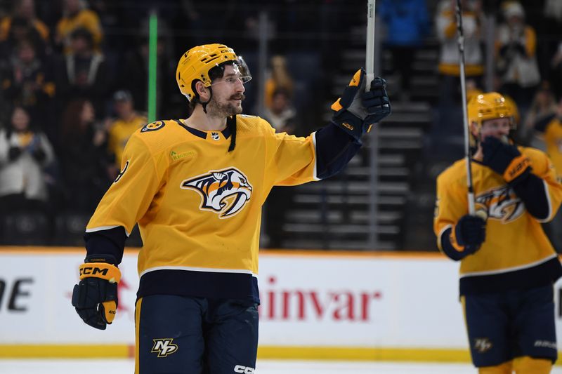 Jan 13, 2024; Nashville, Tennessee, USA; Nashville Predators left wing Filip Forsberg (9) celebrates after a win against the New York Islanders at Bridgestone Arena. Mandatory Credit: Christopher Hanewinckel-USA TODAY Sports